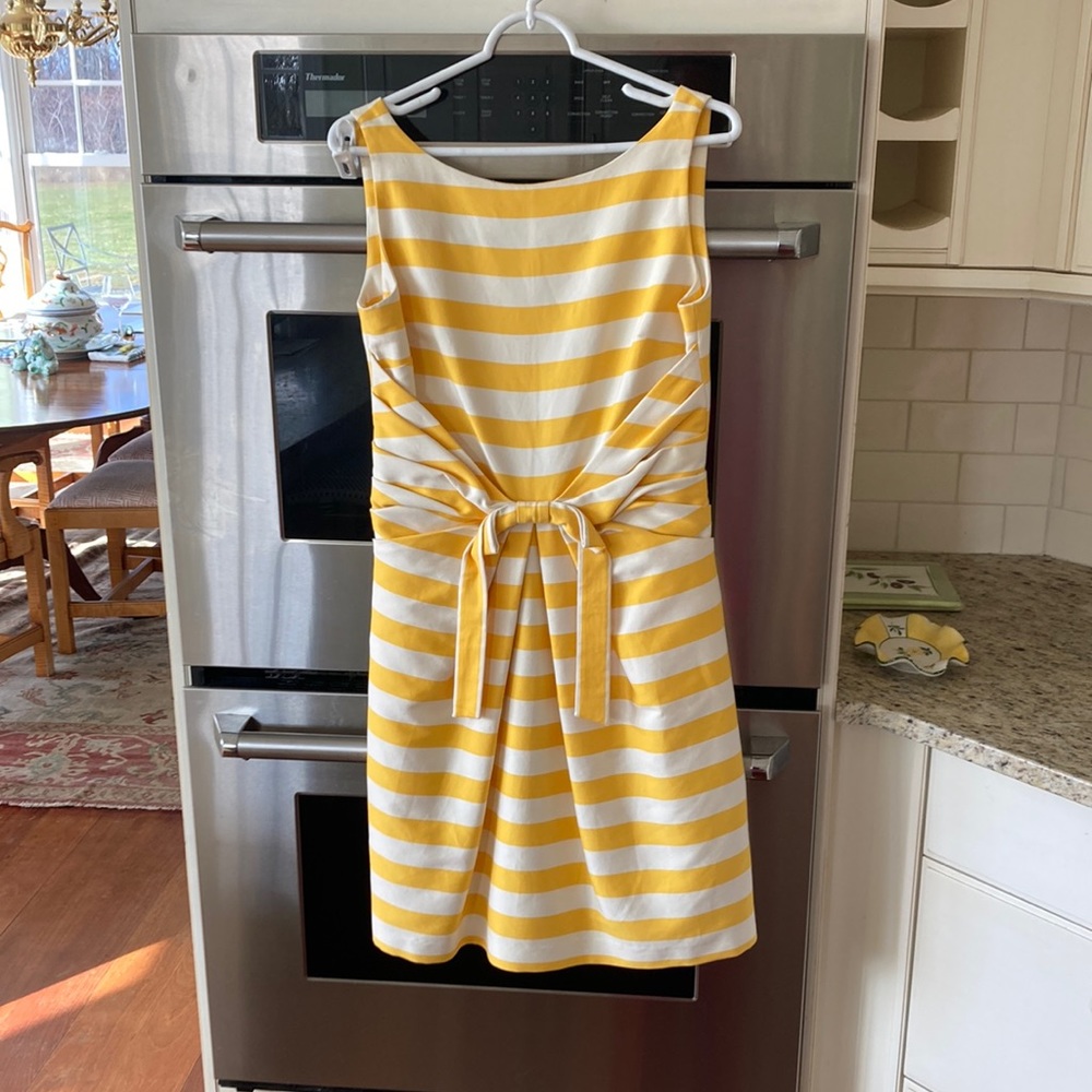 Kate Spade yellow and white striped dress with front bow accent. Size 6.